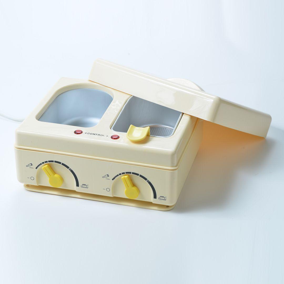 Twin wax device with wax filter